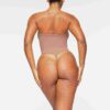 SEAMLESS SCULPT STRAPLESS THONG BODYSUIT