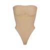 SEAMLESS SCULPT STRAPLESS THONG BODYSUIT