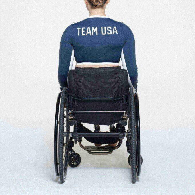 SKIMS FOR TEAM USA SIGNATURE SWIM PARALYMPIC LONG SLEEVE CROPPED T-SHIRT SKIMS FOR TEAM USA SIGNATURE SWIM PARALYMPIC LONG SLEEVE CROPPED T-SHIRT