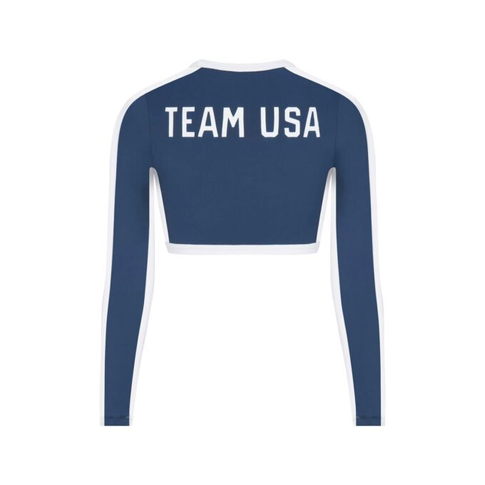SKIMS FOR TEAM USA SIGNATURE SWIM PARALYMPIC LONG SLEEVE CROPPED T-SHIRT SKIMS FOR TEAM USA SIGNATURE SWIM PARALYMPIC LONG SLEEVE CROPPED T-SHIRT